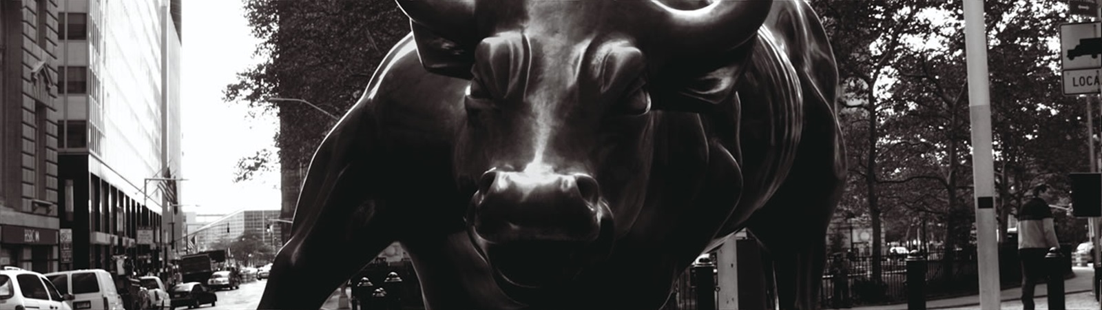 Metal charging bull sculpture